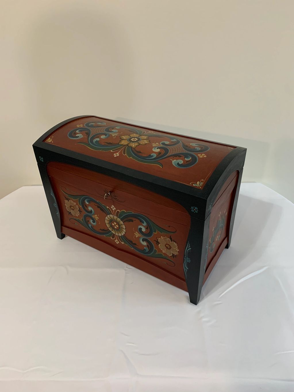 Round top chest painted in the Hallingdal style of Rosemaling.