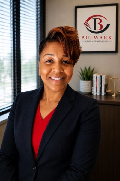 Professional woman smiling in office setting.