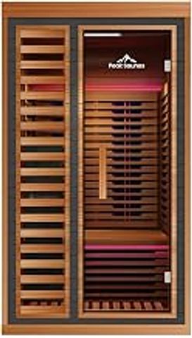 Modern wooden sauna with glass door and pink lighting.