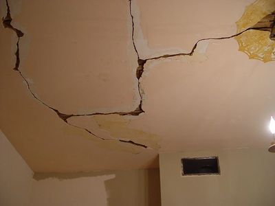 damaged plaster wall and ceiling