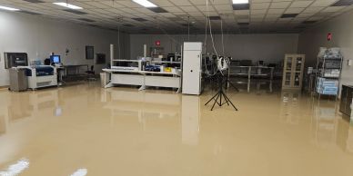 Large empty industrial workspace with machines.