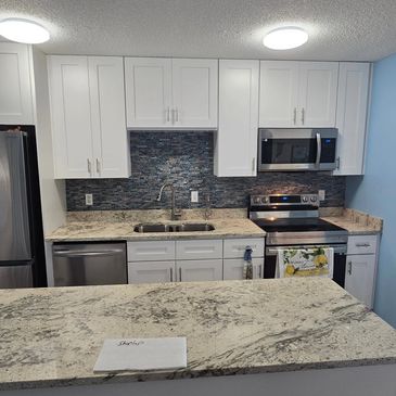 Remodeled kitchen with fresh paint, new cabinets and countertops.
