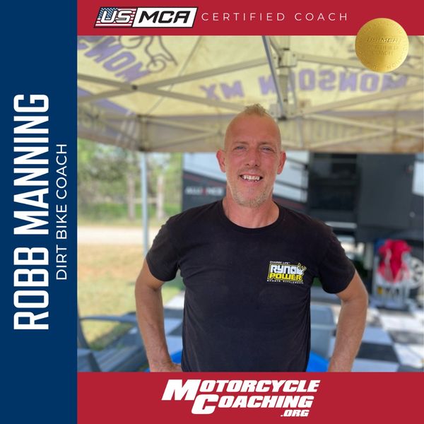 Robb Manning, certified dirt bike coach, smiling confidently under a canopy.