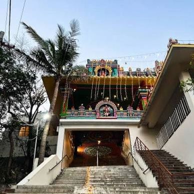 Entrance stairs leading to a colorful temple.