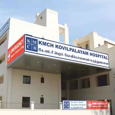 KMCH Kovilpalayam Hospital exterior with emergency signage.