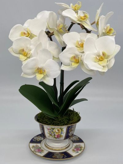 Life-like faux orchid arrangement
