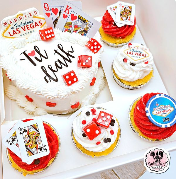 Las Vegas-themed wedding cake and cupcakes with cards, dice, and chips.