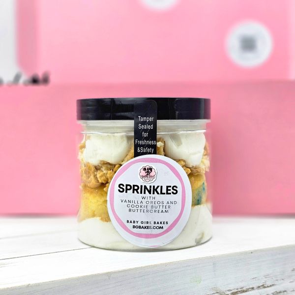 Jar of Sprinkles dessert with vanilla Oreos and cookie butter buttercream from Baby Girl Bakes.