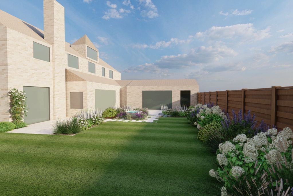 Modern brick house with spacious green lawn and flower beds along a brown wooden fence.