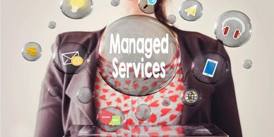 A person holding a tablet with 'Managed Services' and related icons floating above it.