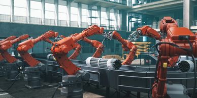 Automated robotic arms assembling and packaging materials in a modern factory.