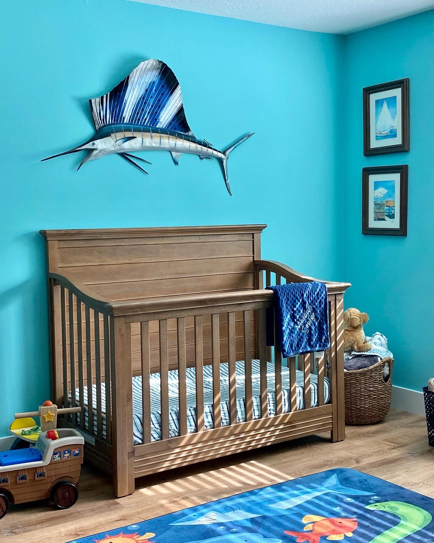 Florida baby boy nursery sailfish over bed taxidermy interior design