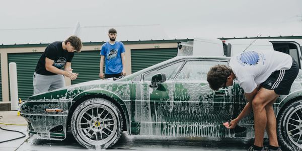 Bigboyz Detailing's technicians performing a clay bar treatment on a Lotus Esprit before Polishing.