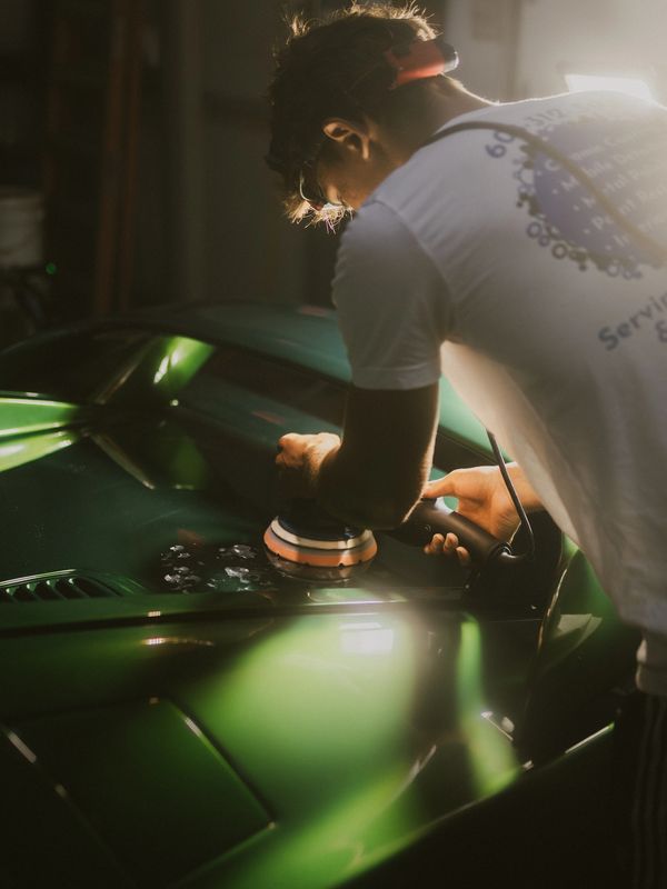Bigboyz detailing technician performing a one step paint correction on a lotus esprit before coating