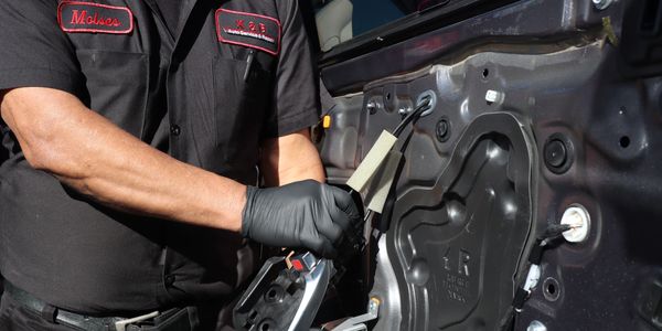 Head mechanic and owner, Moises, fixing a car. K&B Auto Service and Repair is in Encinitas