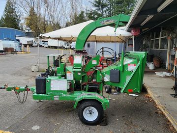 6" limb chipper and wood removal equipment tow behind small family business rentals here