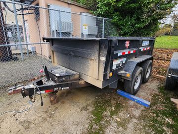 Tow behind dump trailer heavy duty for rent.