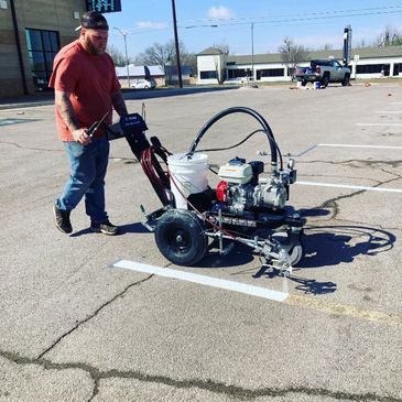 Company in Oklahoma city that offers parking lot line painting services, line striping, 