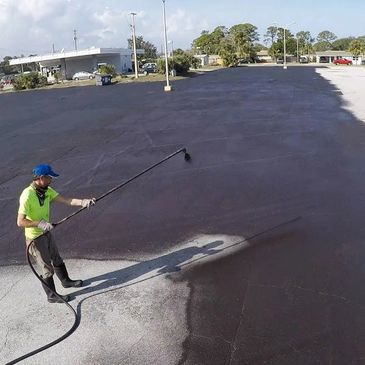 Welch Stripe Co is Seal Coating  an asphalt parking lot in Oklahoma  City