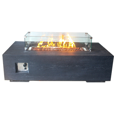 Modern outdoor fire pit with glass wind guard and stone base.