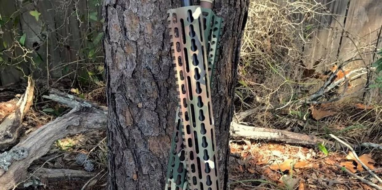 Camoflauge Rifles coated with Cerakote by Guardian Custom Firearm Coating.