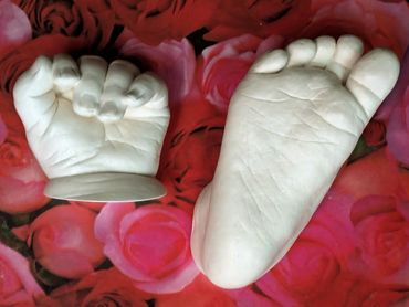 Baby hand and foot casts on roses