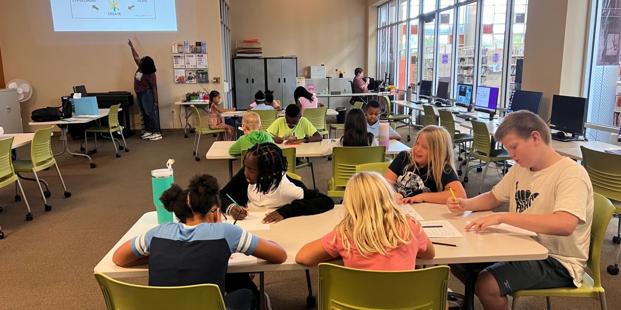 Students working together in a classroom setting.