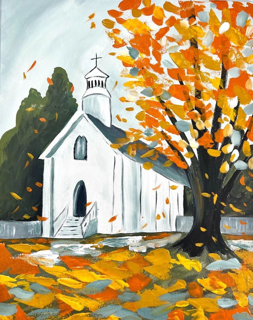 Autumn scene with white church and vibrant fall leaves.
