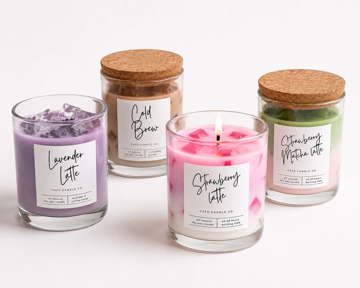 Four colorful latte-scented soy wax candles in glass jars with cork lids.