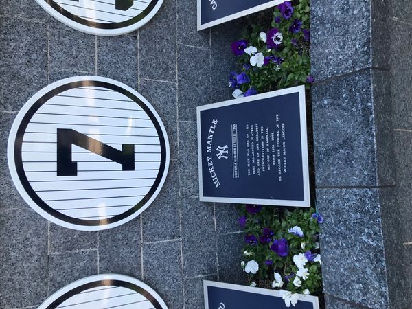 Plaque honoring Mickey Mantle with the number 7 in a pinstripe circle.