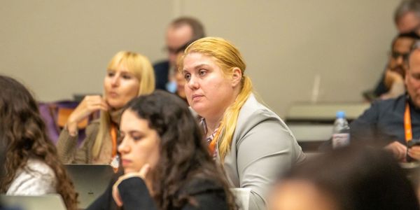 Melissa listening at the Global Summit on Constitutionalism at Texas Law Austin in March 2023.