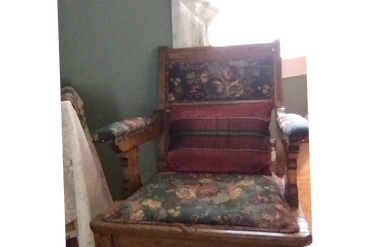 This antique armchair offer a comfortable spot to read or just relax.