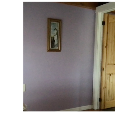 Just past the antique dresser, the solid pine door provides privacy when you are showering.