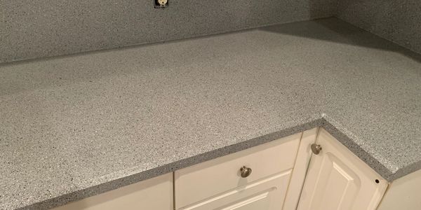 Laminate kitchen counter resurfaced in EuroFleck ™️ Goliad Gray. 