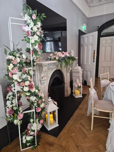 Elegant floral fireplace decoration in a sophisticated room.