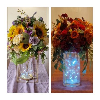Two vibrant floral arrangements with glowing lights in glass vases.