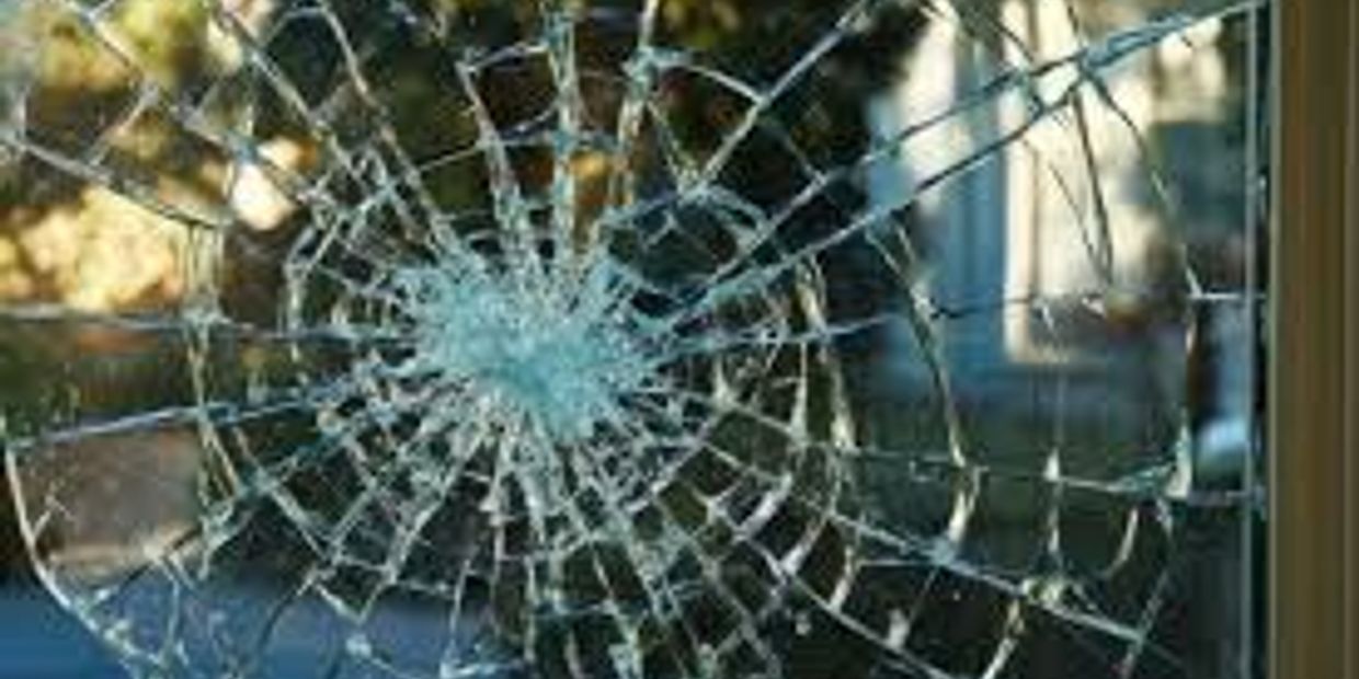 Cracked broken residential glass window