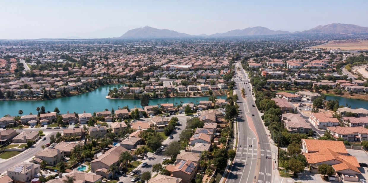 Photo of Moreno Valley homes on waterfront with mountains in background