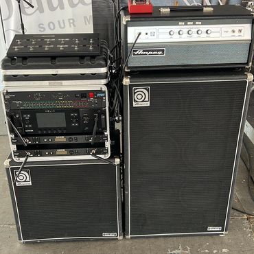 Ampeg bass amplifier setup with Helix rack unit and footswitch.