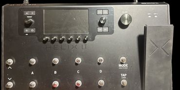 Helix LT guitar multi-effects processor with footswitches and expression pedal.