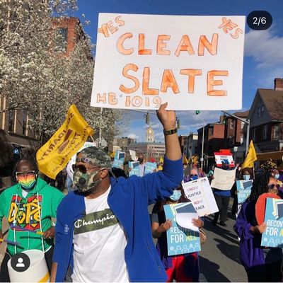 A photo captures Donald Rivers marching in front of the State Capitol in Hartford, Connecticut.