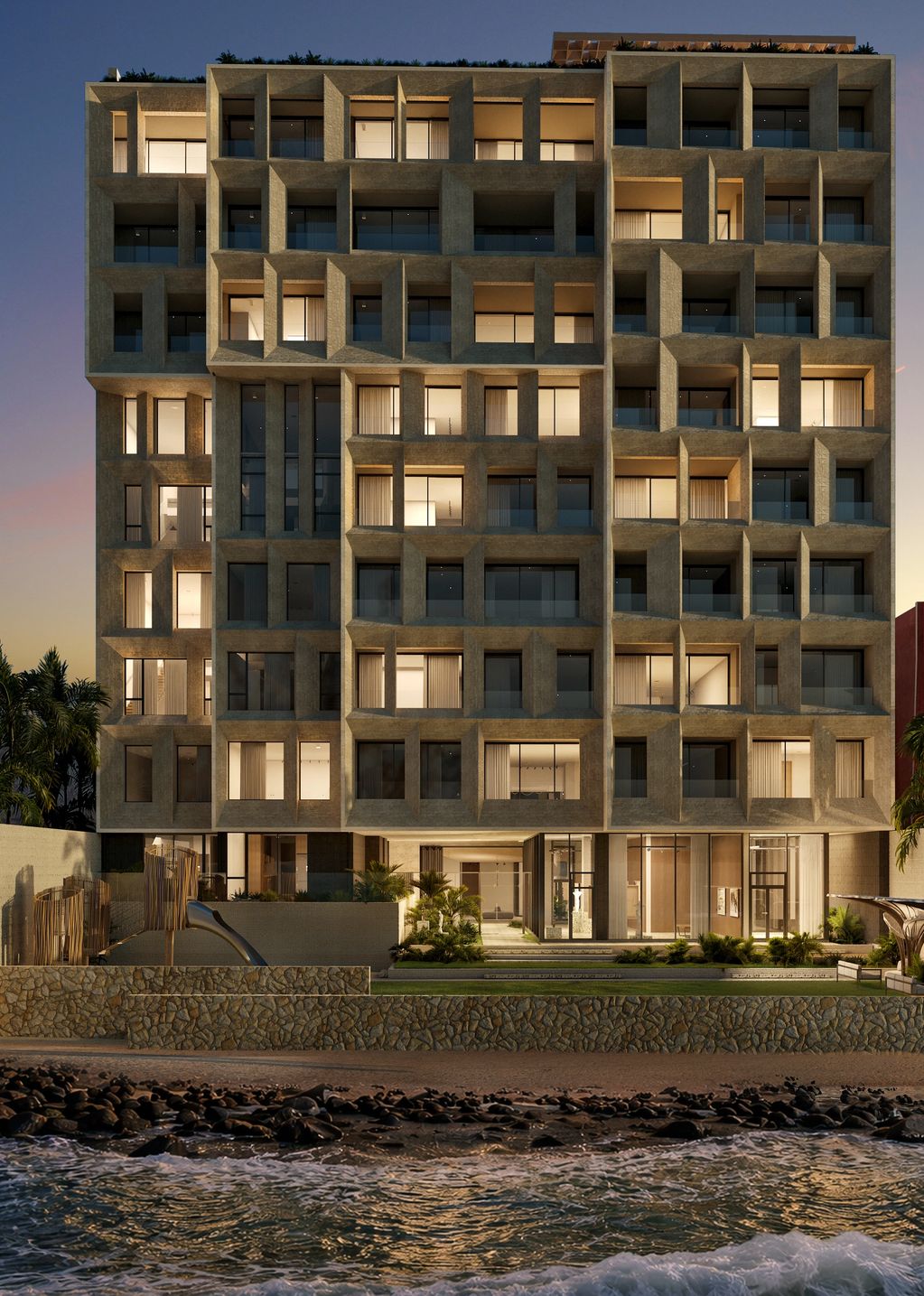Modern beachfront apartment building with geometric concrete facade at dusk.