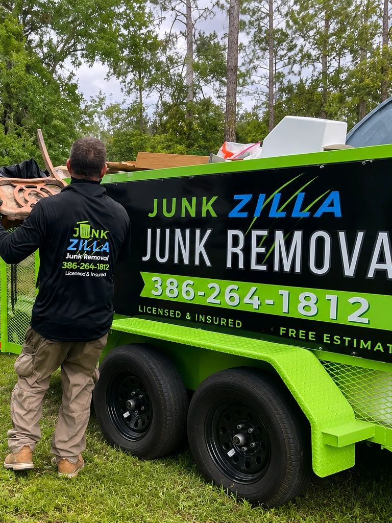 Junk Zilla trailer being loaded during a junk removal pick up in Bunnell, FL