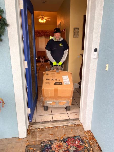 Junk Zilla removing boxes and household items during a residential cleanout in Palm Coast, FL