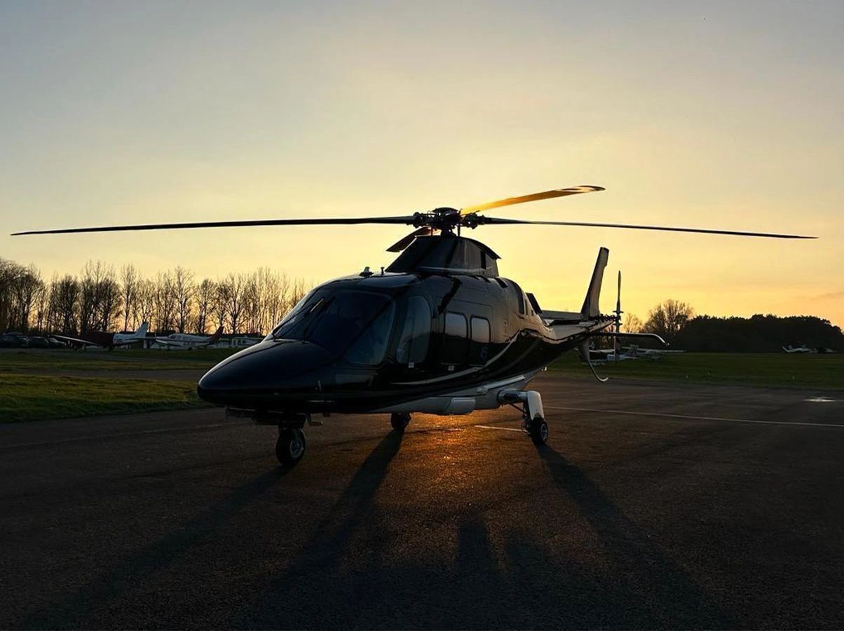 vip helicopter landing at sunset aw109 helicopter charter company event travel