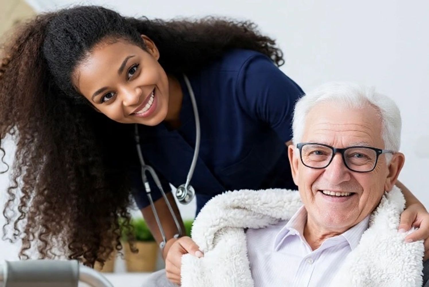 Nurse smiling with elderly patient.