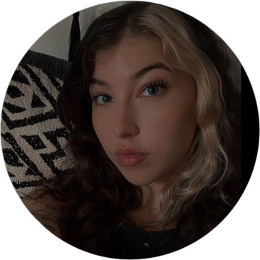 Young woman with half black and half blonde hair.