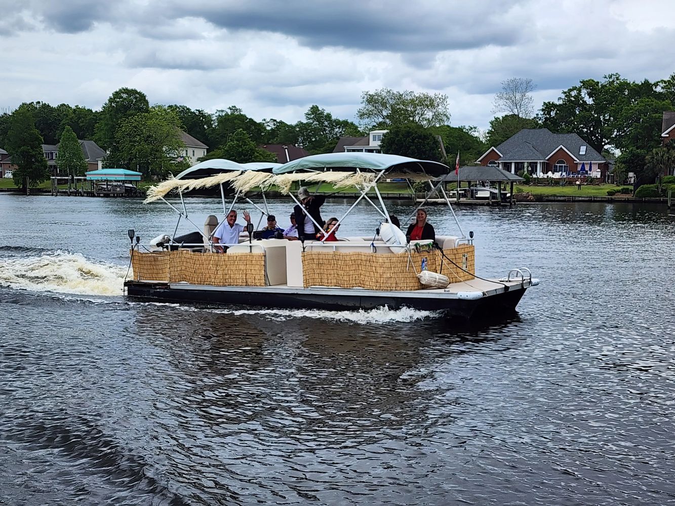 The Tipsy Tiki cruising the pleasant waters of the Trent River