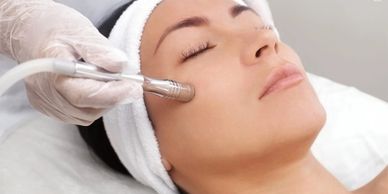 Microdermabrasion facial treatment in progress 
