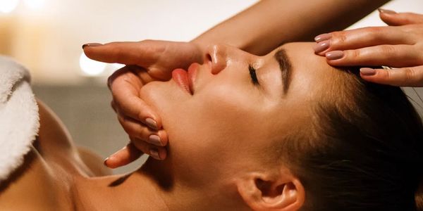 a woman getting a massage at a spa